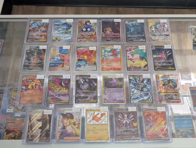 Modern chase cards lined up in the display case with price tags