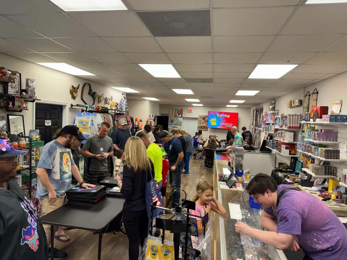 Inside PokeShop 850: apparel racks, binders and the glass display counters